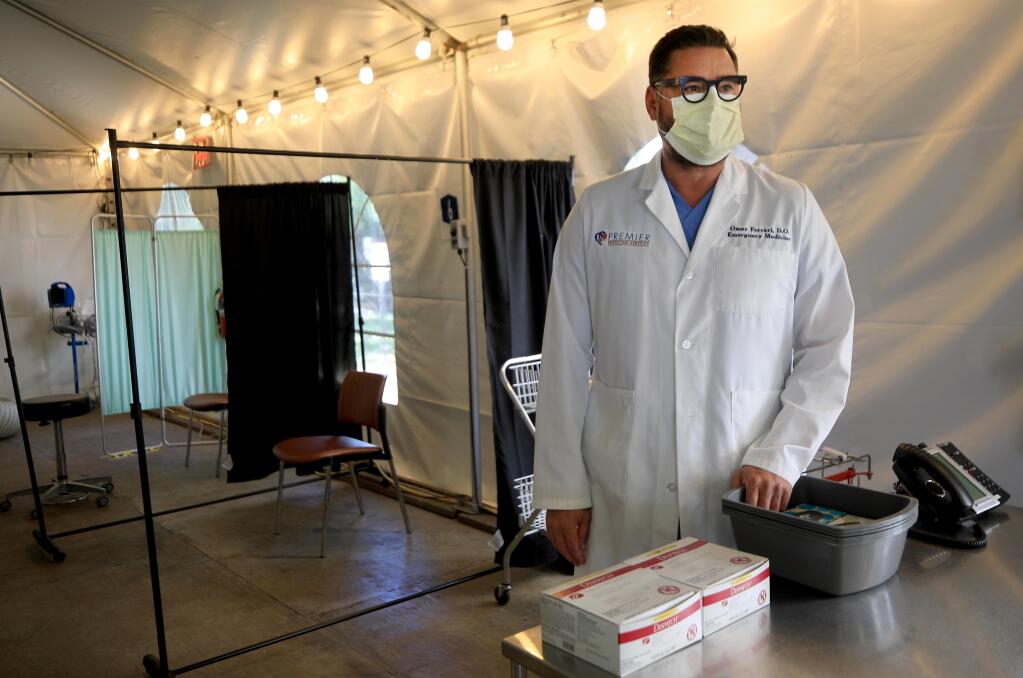 Omar Ferrari, D.O. emergency medicine at Memorial Hospital in Santa Rosa, Friday, July 10, 2020 in the COVID surge tent they haven't had to use since the pandemic started.  (Kent Porter / The Press Democrat) 2020