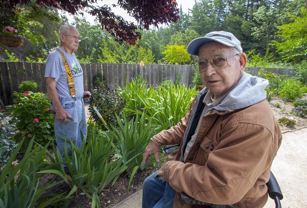 Harold Estes (left) and Robert Orr spend most of their days at Broadway Villa beautifying what used to be an untended strip of land that runs along the east side of the facility. (Photos by Robbi Pengelly/Index-Tribune)