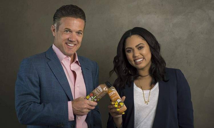 Jon Sebastiani and Ayesha Curry share a toast to their healthful-soup success in June 2016. (ERIK ISAKSON PHOTOGRAPHICS)