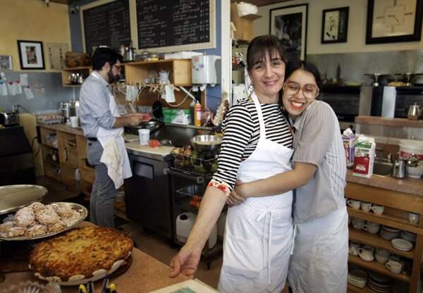 Owner Stephanie Rastetter gets a hug from her daughter Bella Perez at Water Street Bistro on Monday morning April 28, 2014.