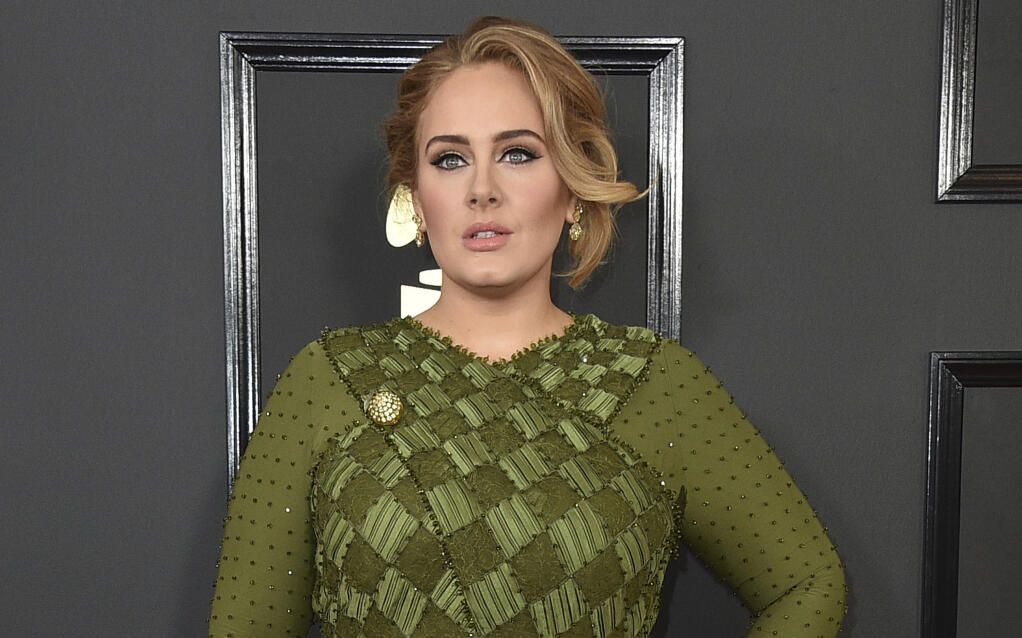 FILE - Adele arrives at the 59th annual Grammy Awards on Feb. 12, 2017, in Los Angeles. (Photo by Jordan Strauss/Invision/AP, File)