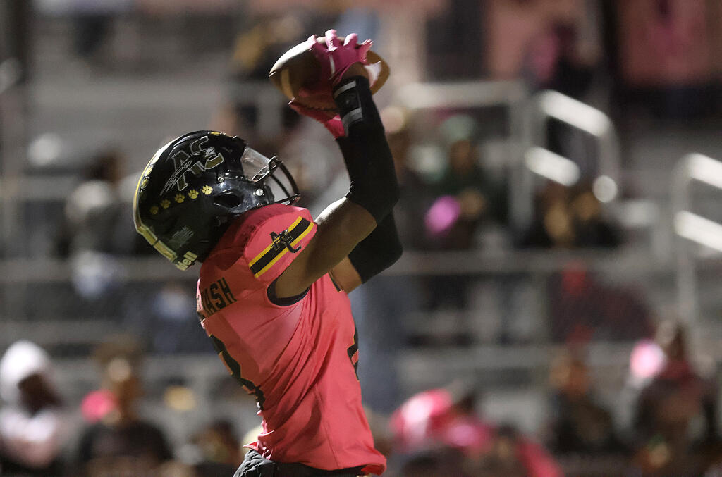 American Canyon High School’s Abdul Kates catches the ball before scoring a touchdown against Napa High School in American Canyon, Friday Oct. 13, 2023. (Beth Schlanker / Press Democrat)