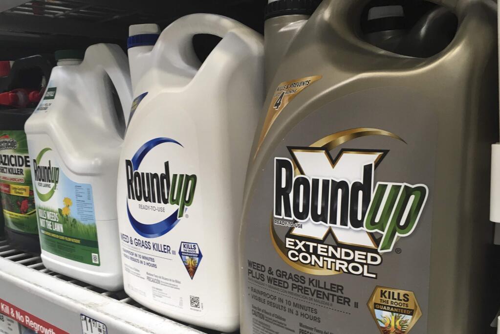 In this Sunday, Feb. 24, 2019 photo, containers of Roundup are displayed on a store shelf in San Francisco. (AP Photo/Haven Daley)