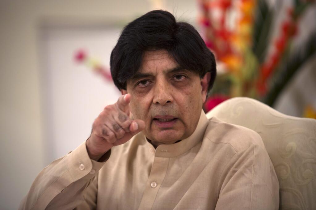 Pakistan's Interior Minister, Chaudhry Nisar Ali Khan addresses a news conference in Islamabad, Pakistan, Tuesday, May 24, 2016. Khan said authorities will perform DNA tests on the body of a man who was killed in an American drone strike to determine whether the slain man is actually Taliban chief Mullah Mohammed Akhtar Mansour. Khan also condemned the drone strike, calling it a violation of Pakistan's sovereignty. (AP Photo/B.K. Bangash)