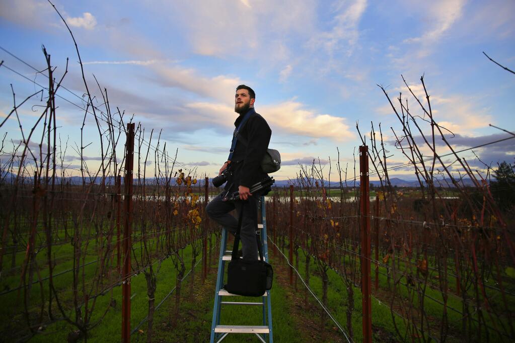 Adam Decker looks for the ideal light while photographing for his Instagram at Lynmar Estate winery, near Sebastopol, on Wednesday, November 30, 2016. Decker has been able to book clients through his Instagram photography.(Christopher Chung/ The Press Democrat)