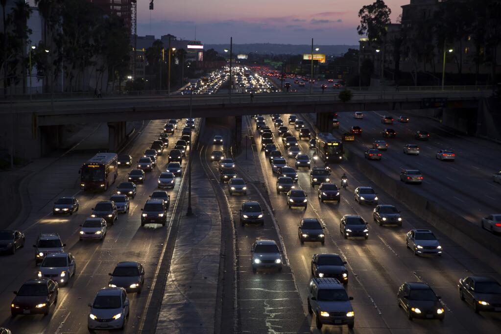 FILE-- Evening rush hour traffic on the Interstate 110 in Los Angeles, Sept. 2, 2015. The Trump administration on Aug. 02, 2018, formally announced its long-awaited proposal to dramatically weaken an Obama-era regulation on planet-warming vehicle tailpipe pollution. The proposal would freeze rules requiring cleaner, more efficient cars. (Monica Almeida/The New York Times)