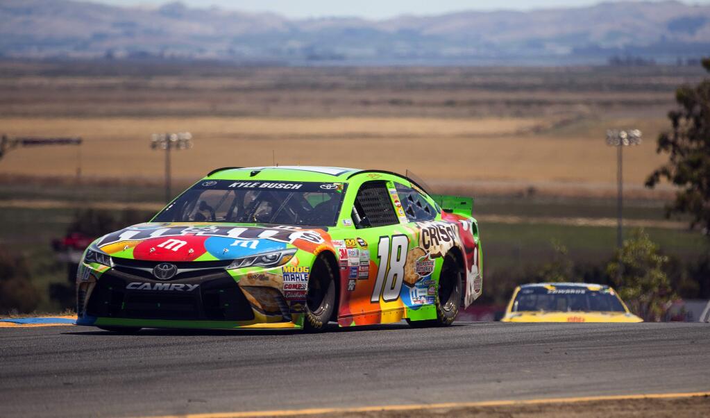 Owen Barrett/Special to the Index-TribuneKyle Busch, who overcame a broken leg and foot sustained at the Daytona 500 earlier in the year, drives his No. 18 M&Ms Toyota car to his second NASCAR Toyota/Save Mart 350 victory at Sonoma Raceway on Sunday.