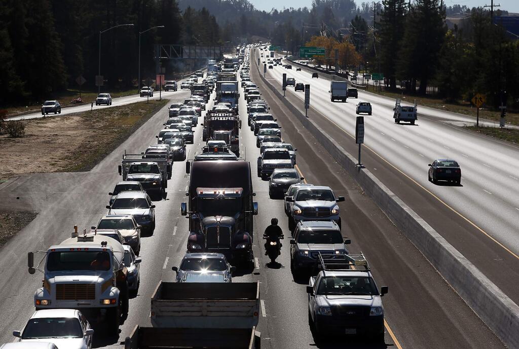 Traffic on northbound Highway 101 is gridlocked, as seen from the Rohnert Park Expressway overpass, due to traffic from the opening of the Graton Resort & Casino in Rohnert Park on Tuesday, November 5, 2013. (Christopher Chung/ The Press Democrat)