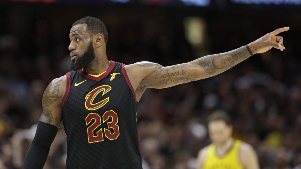 The Cleveland Cavaliers' LeBron James talks with a teammate in the second half of Game 7 of a first-round playoff series against the Indiana Pacers, Sunday, April 29, 2018, in Cleveland. (AP Photo/Tony Dejak)
