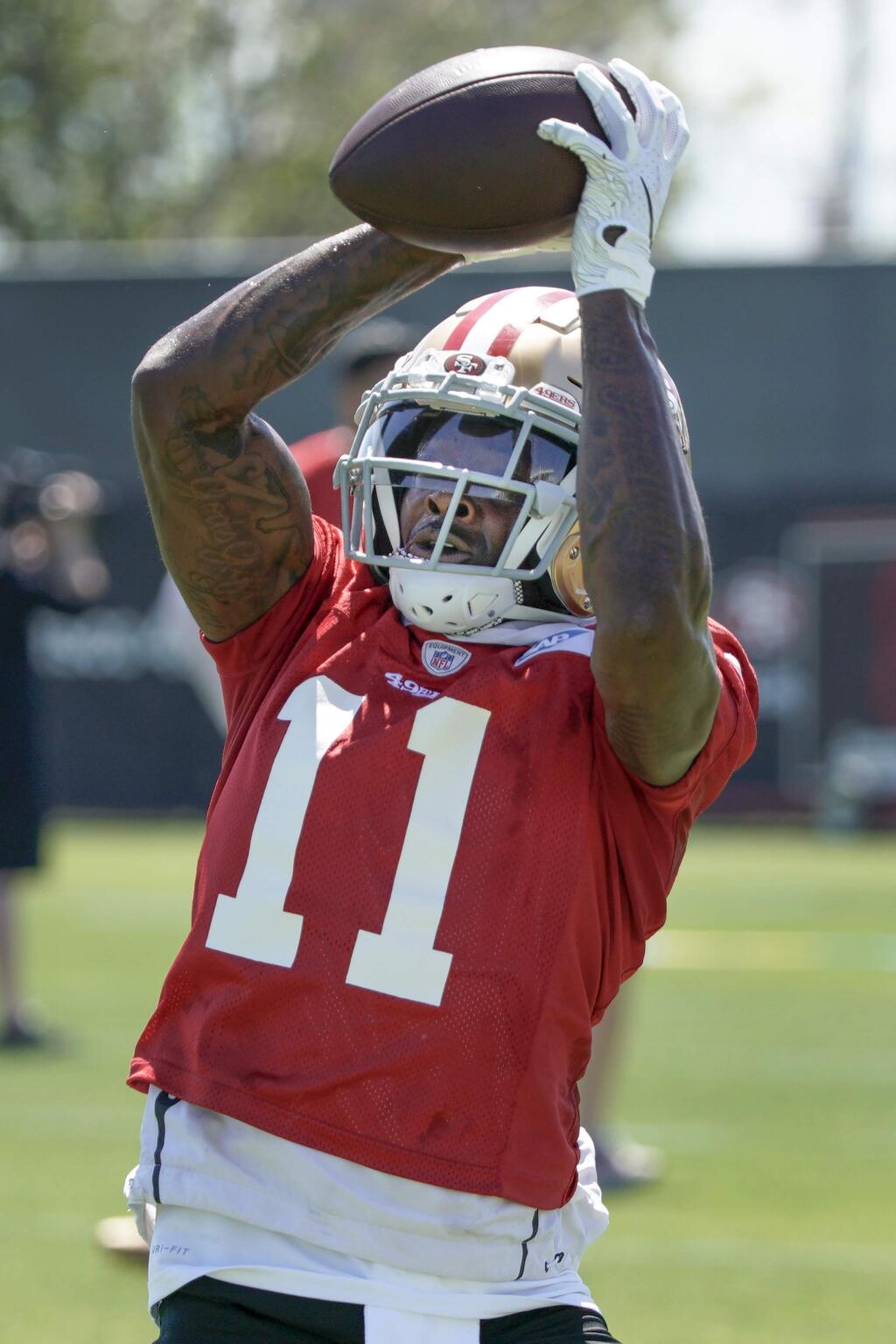 San Francisco 49ers wide receiver Marquise Goodwin catches a pass during a drill at the team's training facility in Santa Clara, Tuesday, June 11, 2019. (AP Photo/Tony Avelar)