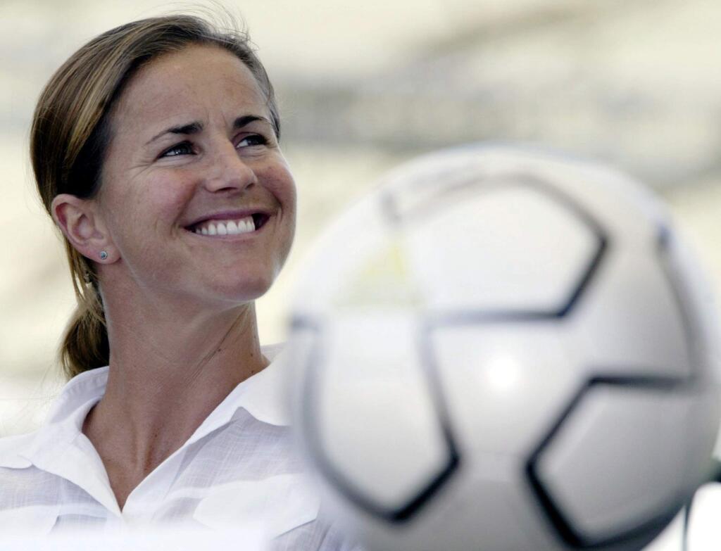 FILE - In this May 13, 2004, file photo, San Jose CyberRays soccer star Brandi Chastain is shown during a news conference in Carson, Calif. Chastain and Shannon MacMillan, and MLS Commissioner Don Garber have been elected to the National Soccer Hall of Fame. Chastain, who scored the winning goal in the 1999 World Cup final shootout against China, was selected on the player ballot. (AP Photo/Nick Ut, File)