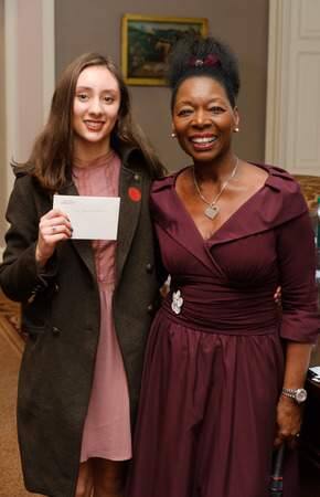 Tallulah Lefkowitz, 16, from California, receives a poetry prize from Baroness Floella Benjamin at the 2017 Keats-Shelley Prize for essays and poems, at the Society of Antiquaries in London. PHOTO BY FRANTZESCO KANGARIS/PA WIRE