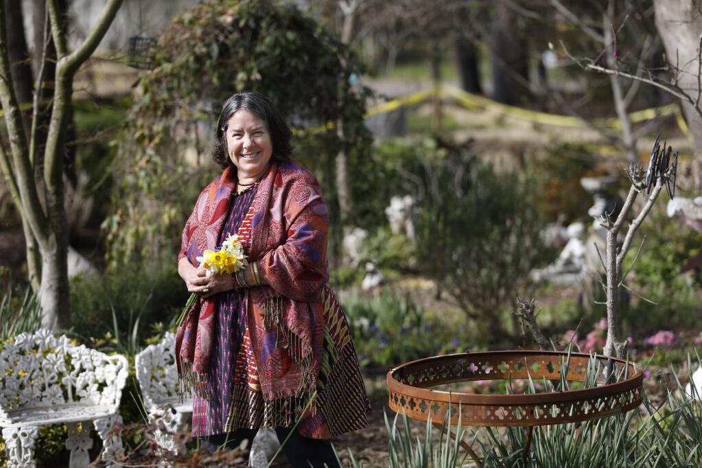 Floral designer Natasha Drengson, who will be participating in the Bouquets to Art 2018 exhibit at the de Young Museum in San Francisco, stands in the garden of her mother Susan Braito in Glen Ellen, on Tuesday, March 6, 2018. (BETH SCHLANKER/ The Press Democrat)