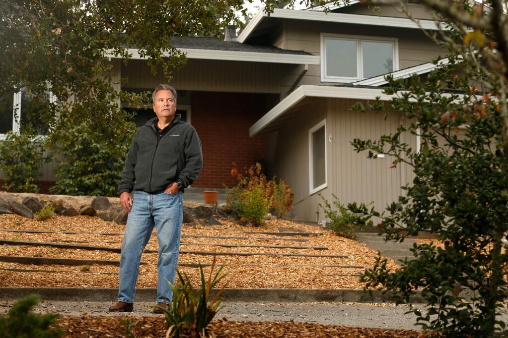 Realtor Jeff Hill of Bertolone Realty stands in front of a home he is selling, which is about to go into escrow, in Santa Rosa, California, on Tuesday, November 13, 2018. (Alvin Jornada / The Press Democrat)