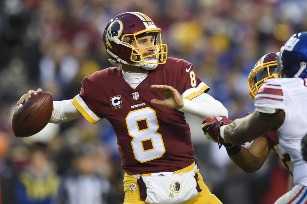 In this Jan. 1, 2017 file photo, Washington Redskins quarterback Kirk Cousins passes during the first half against the New York Giants in Landover, Md. (AP Photo/Nick Wass, File)