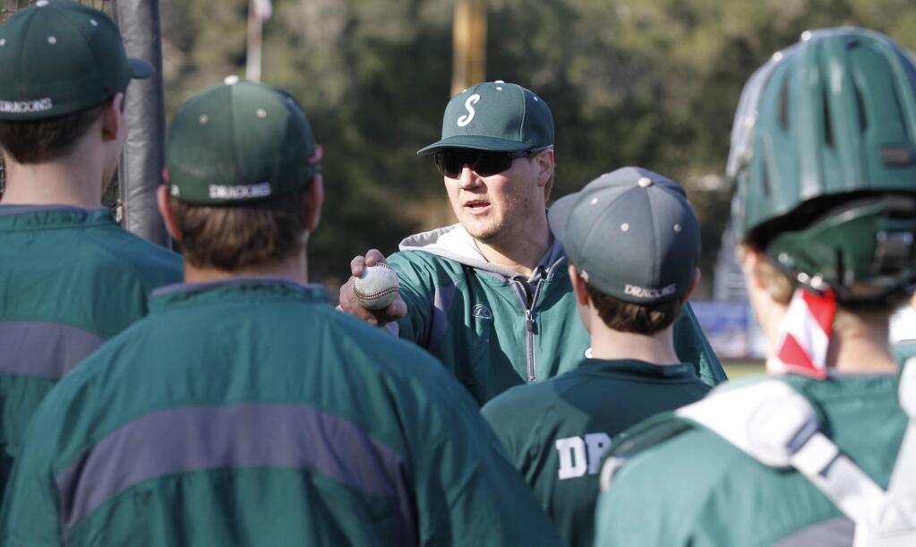 Bill Hoban/Index-TribuneNew Dragon skipper Ian Slaney goes over some things with his team at Wednesday's practice. The Dragons open their season today, Friday, Feb. 23, when they host Eureka at Arnold Field.