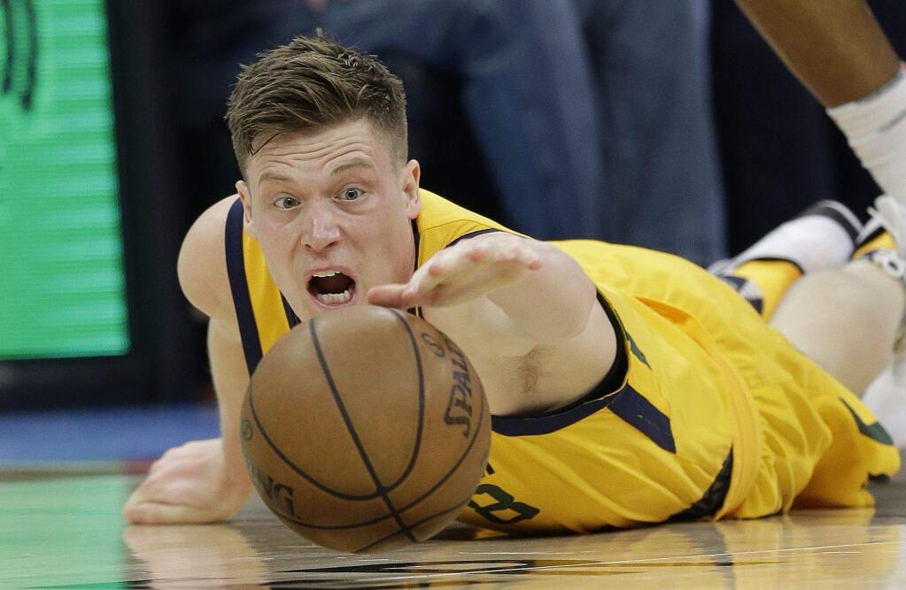 Utah Jazz forward Jonas Jerebko goes to the floor for the ball during the second half of the team's game against the Sacramento Kings on Saturday, March 3, 2018. The Jazz won 98-91. (AP Photo/Rich Pedroncelli)