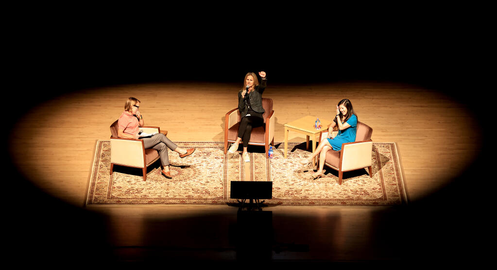 Brandi Chastain, middle, and Kristi Yamaguchi, right, answer audience questions from Press Democrat journalist Kerry Benefield, Wednesday, Sept. 22, 2021 during the Women in Conversation at the Green Music Center at Sonoma State University.  (Kent Porter / The Press Democrat) 2021