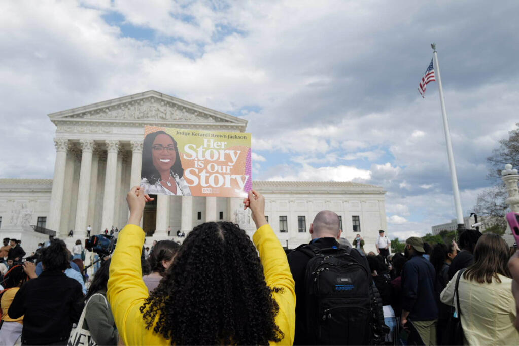 People gather outside the Supreme Court on Friday 2022, to celebrate Senate confirmation on Ketanji Brown Jackson. (CHERISS MAY / New York Times)