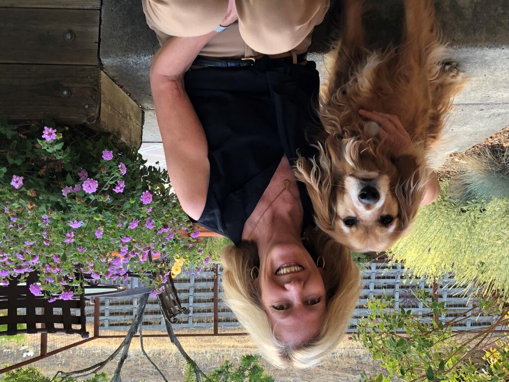 Ashley Evans, director of finance for Marin Humane, with Lucy the dog