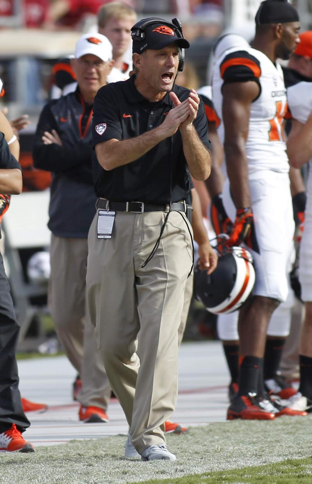 Oregon State head coach Mike Riley claps his hands during the second half of an NCAA college football game against Stanford, Saturday, Oct. 25, 2014, in Stanford, Calif. (AP Photo/George Nikitin)