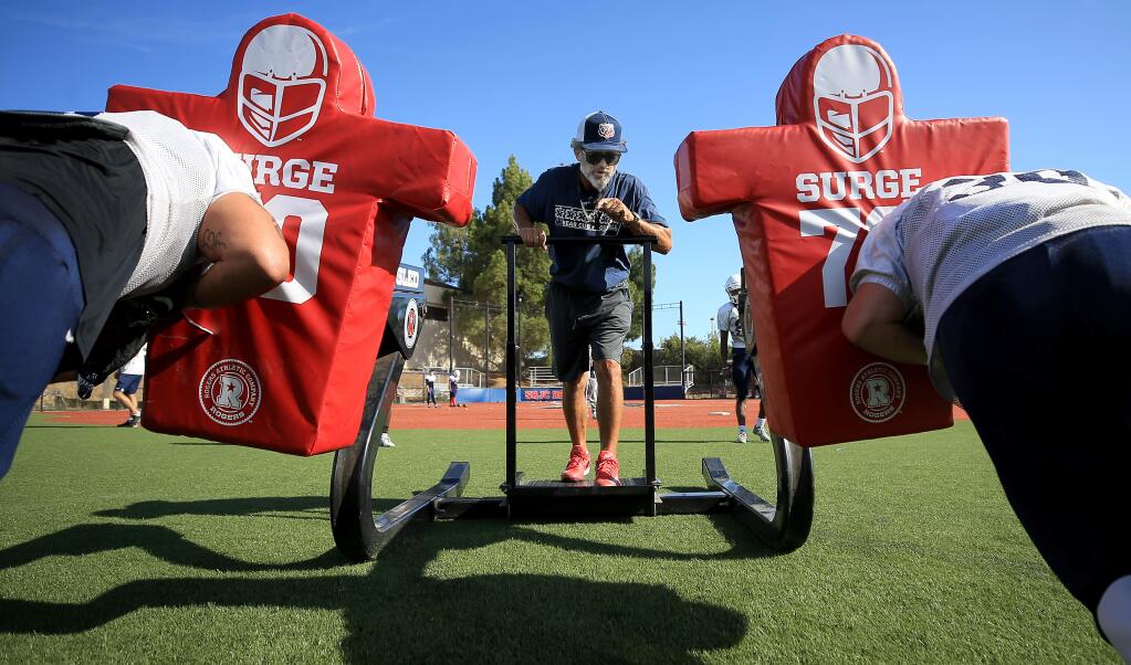 Santa Rosa Junior College head football coach Lenny Wagner oversees a blocking drill, Wednesday, August 21, 2019. (Kent Porter / The Press Democrat) 2019