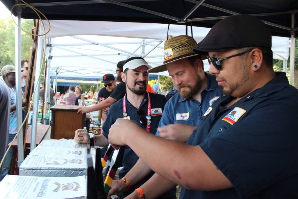 Russian River Beer Revival and bar-be-cue cookoff, benefiting West County Community Services such as the Russian River Senior Resource Center, with Bear Republic employee volunteers (from left) David Reynolds-Ojeda, Roger Herpst and Israel Lopez.