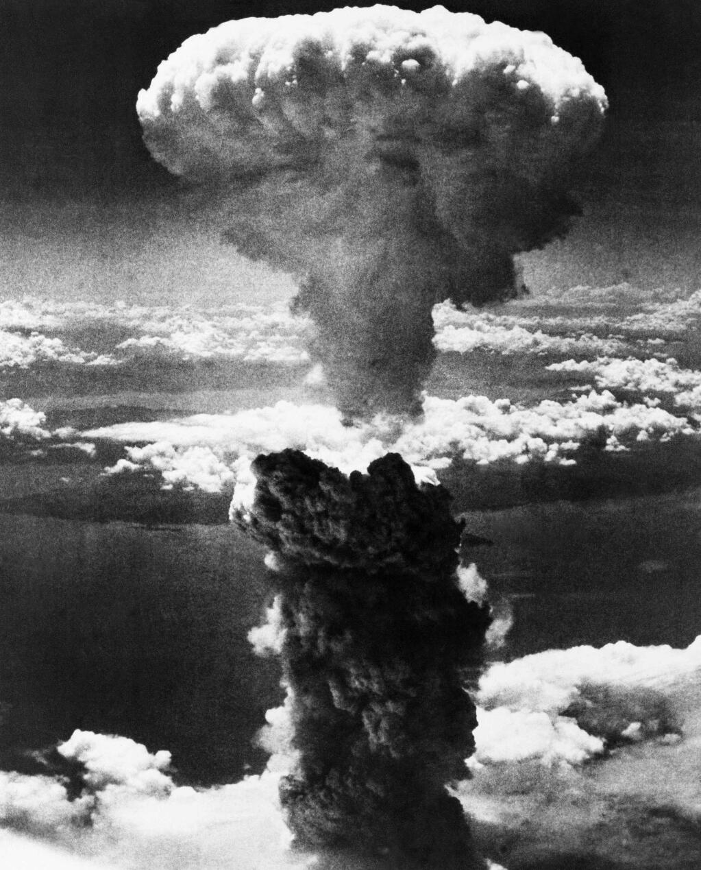 A mushroom cloud rises after an atomic bomb exploded above Nagasaki, Japan. (Associated Press, 1945)