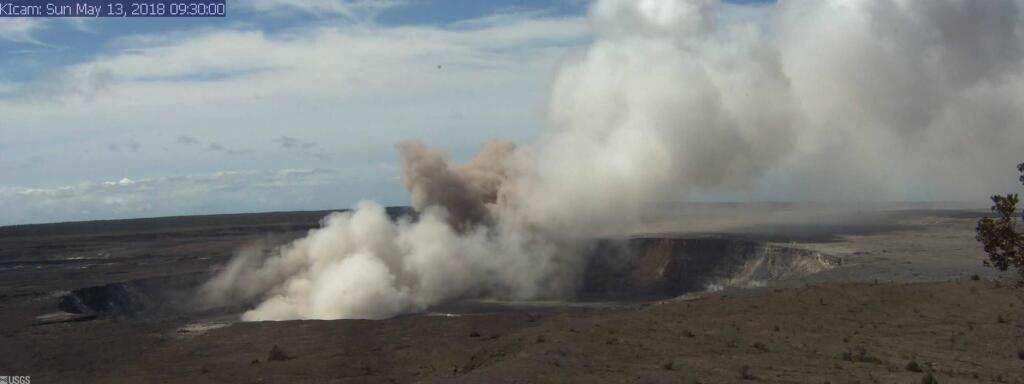 This Sunday, May 13, 2018, image released by the U.S. Geological Survey, shows the Kilauea Caldera at 9:30 a.m. HST, taken with a research camera mounted in the observation tower at the Hawaiian Volcano Observatory in the Big Island of Hawaii. The camera is looking SSE towards the active vent in Halema?uma?u, 1.9 km (1.2 miles) from the webcam. For scale, Halema?uma?u is approximately 1 km (0.6 mi) across and about 85 m (~280 ft) deep. A new fissure emitting steam and lava spatter spurred Hawaii officials to call for more evacuations on Sunday as residents braced for an expected eruption from the Kilauea volcano. Geologists warn that Kilauea's summit could have an explosive steam eruption that would hurl rocks and ash miles into the sky. (U.S. Geological Survey via AP)