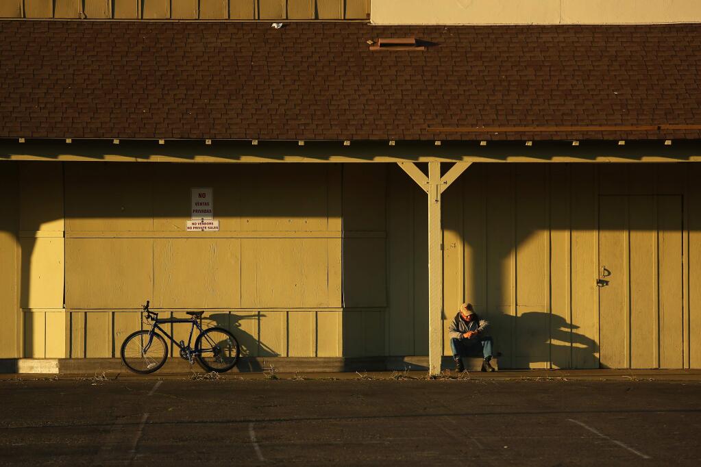 A girl rides her bicycle near the site of old Albertson's on Sebastopol Ave. on Sunday, June 14, 2015 south of Santa Rosa, California . (BETH SCHLANKER/ The Press Democrat)