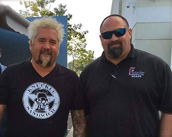 Guy Fieri and Chris Keys, director of shelter and recovery ministries at Redwood Gospel Mission. Fieri's 'Guy's Grocery Games' television cooking show donates thousands of pounds of food weekly to the mission during the four months of recording at the Santa Rosa studio dubbed 'Flavortown Market.' (Redwood Gospel Mission 2015)