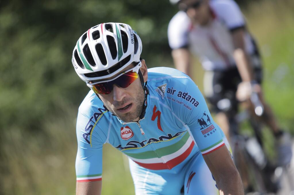 Overall leader Vincenzo Nibali of Italy pedals during a training near Besancon, eastern France, Tuesday, July 15, 2014. (AP Photo/Laurent Cipriani)