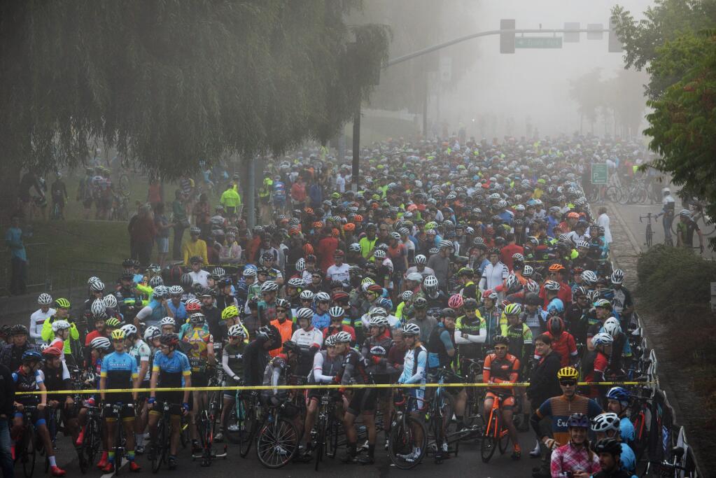 Cyclists gather at the starting line on Stony Point Road next to the Finely Community Center in Santa Rosa, California at the start of Levi's GranFondo bicycle ride through Sonoma County Saturday. September 30, 2017.(Photo: Erik Castro/for The Press Democrat)