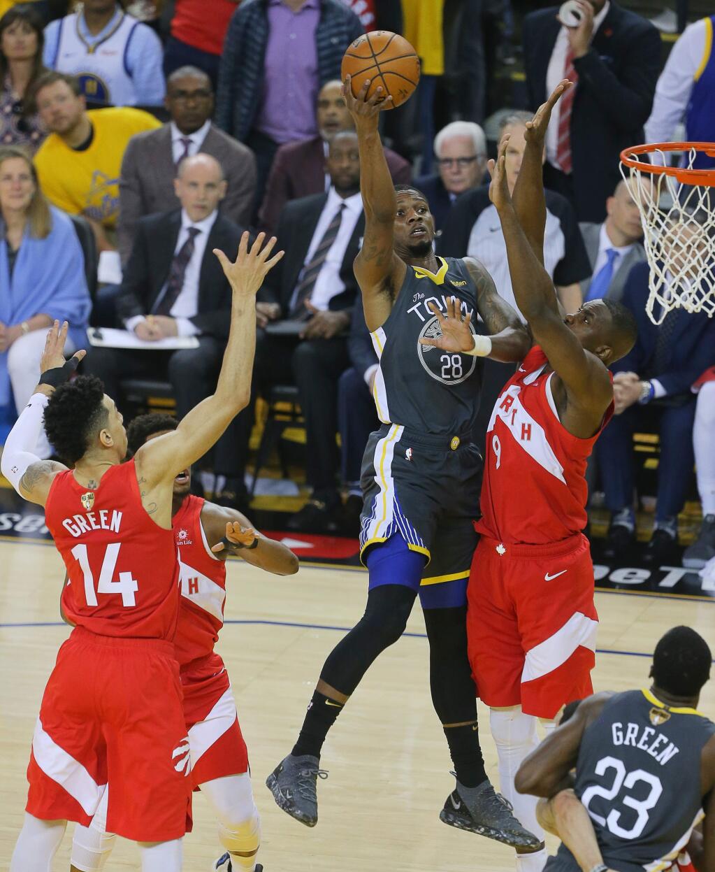 Golden State Warriors forward Alfonzo McKinnie shoots over Toronto Raptors center Serge Ibaka during Game 4 of the NBA Finals in Oakland on Friday, June 7, 2019. (Christopher Chung / The Press Democrat)