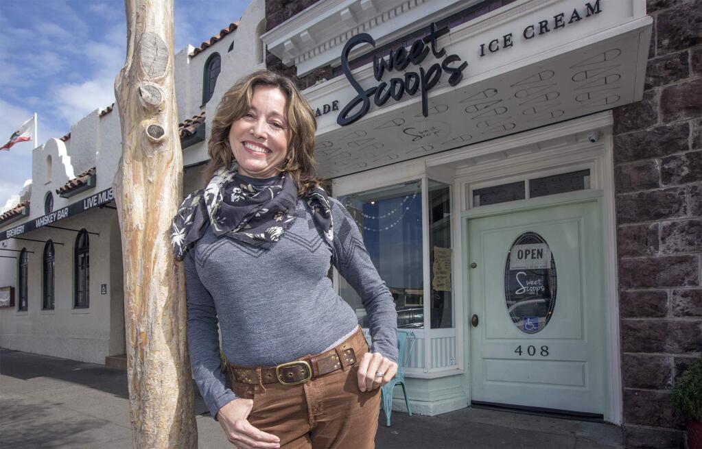 Leslie Tipple, chairman of Sonoma's Design Review and Historic Preservation Commission, in front of Sweet Scoops Ice Cream mint-colored door on First Street East. In the store's previous incarnation, as Grandma's Ice Cream, the door was painted bright pink and caused quite a furor among the locals, who found the color to be offensive because it was historically inaccurate. (Photo by Robbi Pengelly/Index-Tribune)