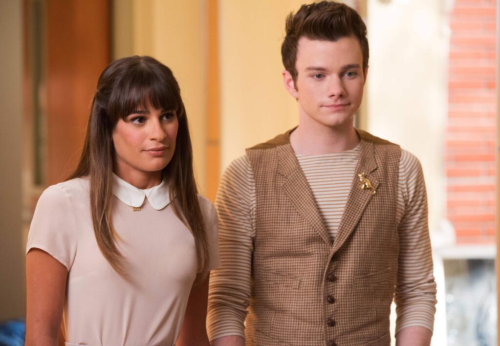 This photo released by Fox shows, Lea Michele, left, and Chris Colfer, in a scene from 'Glee.' The media advocacy group GLAAD on Wednesday, Oct. 1, 2014, released its annual report on diversity on TV, including depictions of gay characters. (AP Photo/Fox, Eddy Chen)