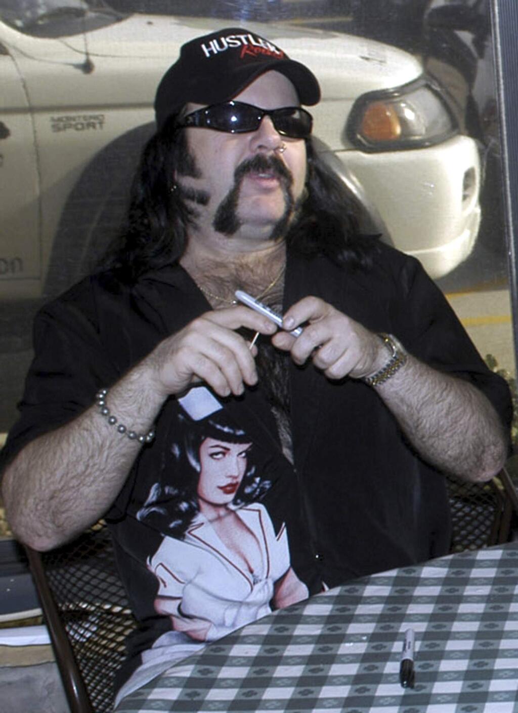 FILE - In this May 20, 2004 file photo shows Vinnie Paul Abbott in Amarillo, Texas. Paul, co-founder and drummer of metal band Pantera, has died at 54. Pantera's official Facebook page posted a statement early Saturday, June 23, 2018 announcing his death. Paul's representative confirmed the death to Billboard. No cause of death was mentioned. Paul's real name was Vincent Paul Abbott. He and his brother, Dimebag Darrell, formed Pantera in 1981.(AP Photo/Ralph Duke, File)