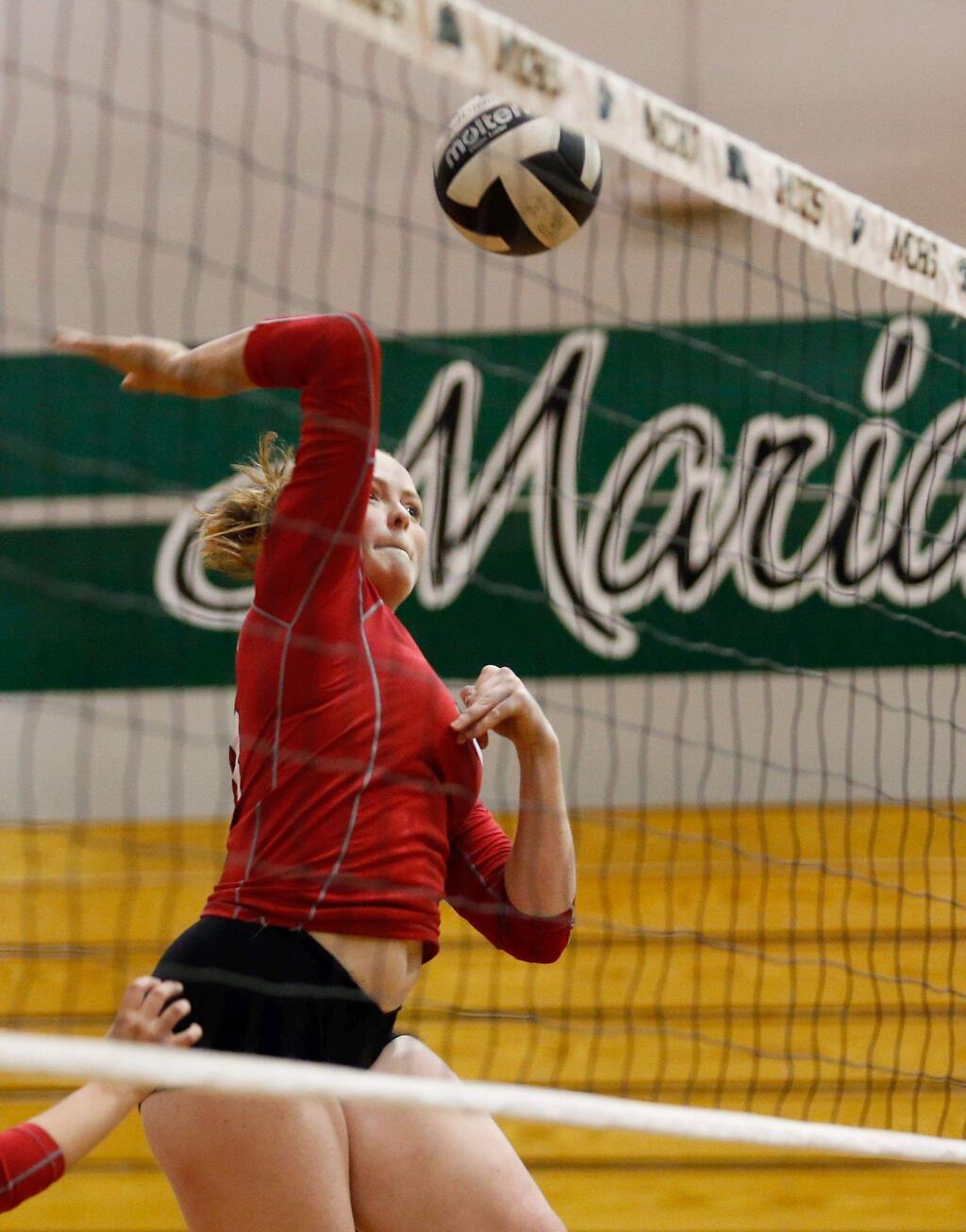 Montgomery's Kailey MacKinnon (13) goes up to spike the ball during a varsity volleyball match between Montgomery and Maria Carrillo high schools in Santa Rosa, California on Tuesday, October 3, 2017. (Alvin Jornada / The Press Democrat)