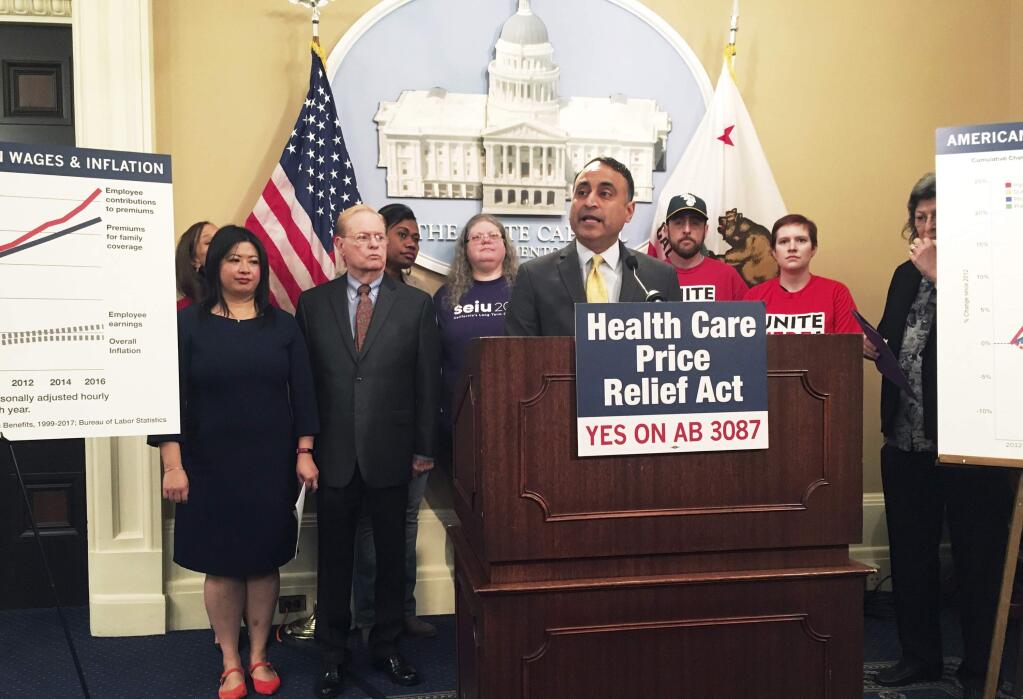 California Assemblyman Ash Kalra, D-San Jose, discusses his proposal to create government-imposed price controls for hospital stays, doctor visits and other health care services during a news conference on Monday, April 9, 2018 at the state Capitol in Sacramento, Calif. The proposal, which drew swift opposition from the health care industry, comes amid a fierce debate about health care prices in California and around the country. (AP Photo/Jonathan J. Cooper)