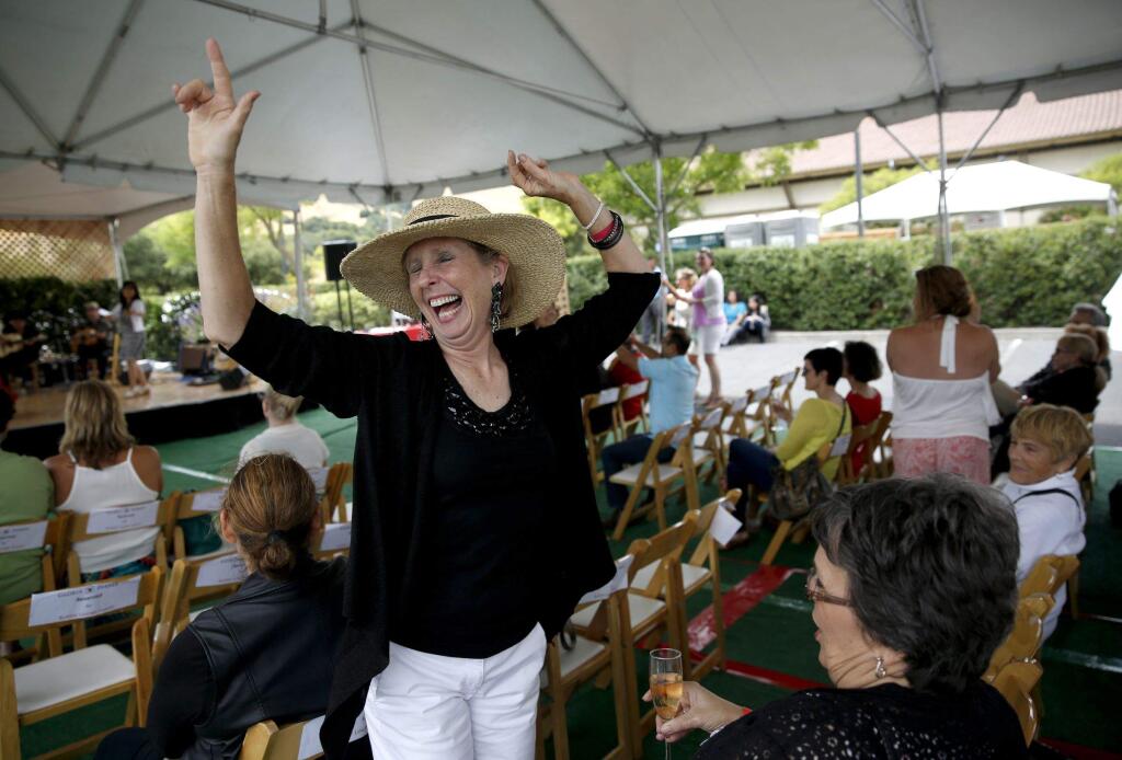 Molly Mazzella of Campbell, Calif., dances to live music during the 22nd annual Catalan Festival at Gloria Ferrer on Sunday, July 20, 2014 in Sonoma, California. (BETH SCHLANKER/ The Press Democrat)