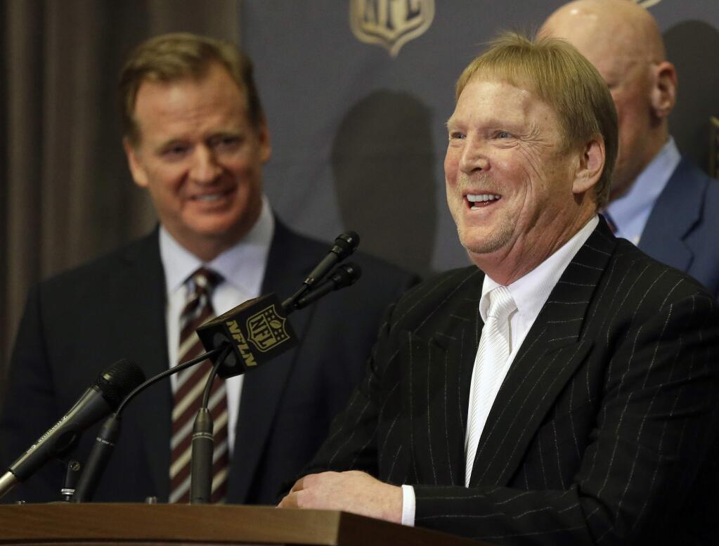 In this Jan. 12, 2016, file photo, NFL Commissioner Roger Goodell, left, laughs as Oakland Raiders owner Mark Davis talks to the media after an NFL owners meeting in Houston. (AP Photo/Pat Sullivan, File)