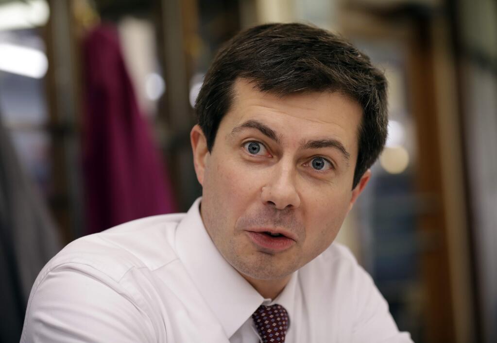 In this Jan. 10, 2019 photo, South Bend, Ind. Mayor Pete Buttigieg, talks with an AP reporter at Farmers Market in South Bend, Ind. (AP Photo/Nam Y. Huh)