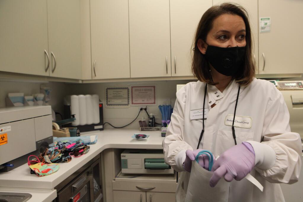 Petaluma, CA, USA. Monday, April 13, 2020._ Yolanda Mangrum, DDS of Petaluma Dental Group is offering sanitization of homemade masks at their clinic in Petaluma. (CRISSY PASCUAL/ARGUS-COURIER STAFF)
