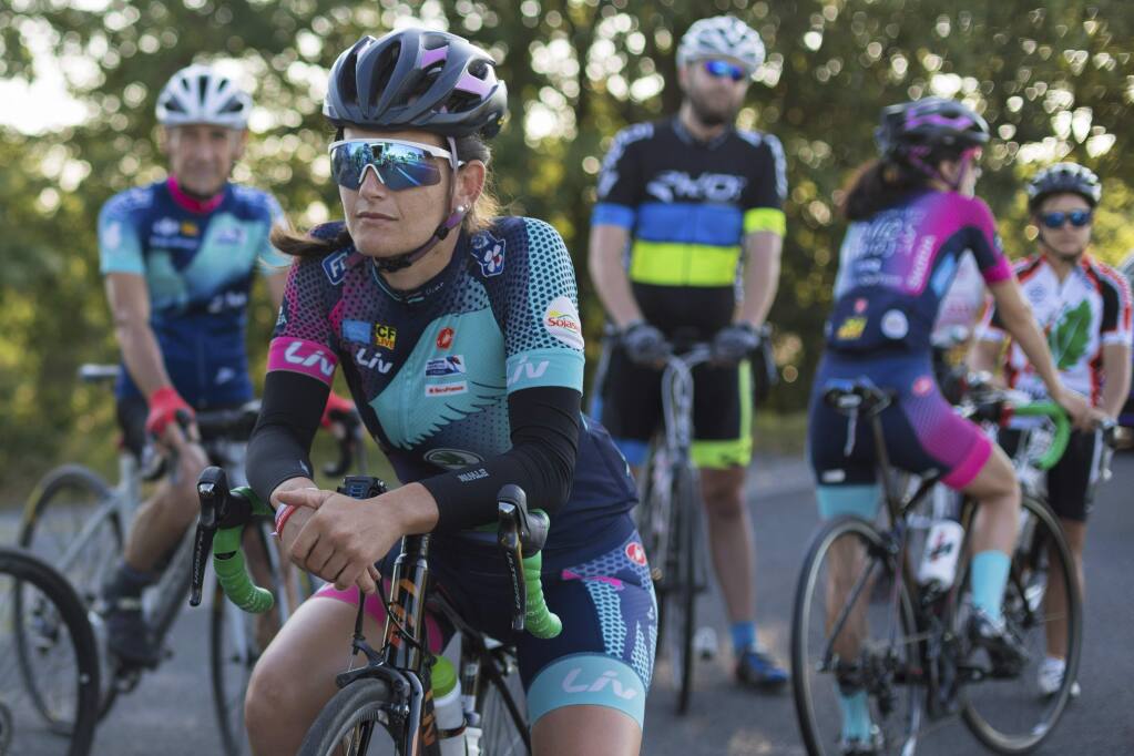 Stephanie Bonfils contemplates the task ahead before the 218-kilometer (135-mile) stage from Carcassonne to Bagneres-de-Luchon in the Pyrenees, France, Monday July 23, 2018. Bonfils is a member of a 13-woman team cycling the Tour de France route to promote women's cycling and a return of the women's Tour. (AP Photo/Ciaran Fahey)