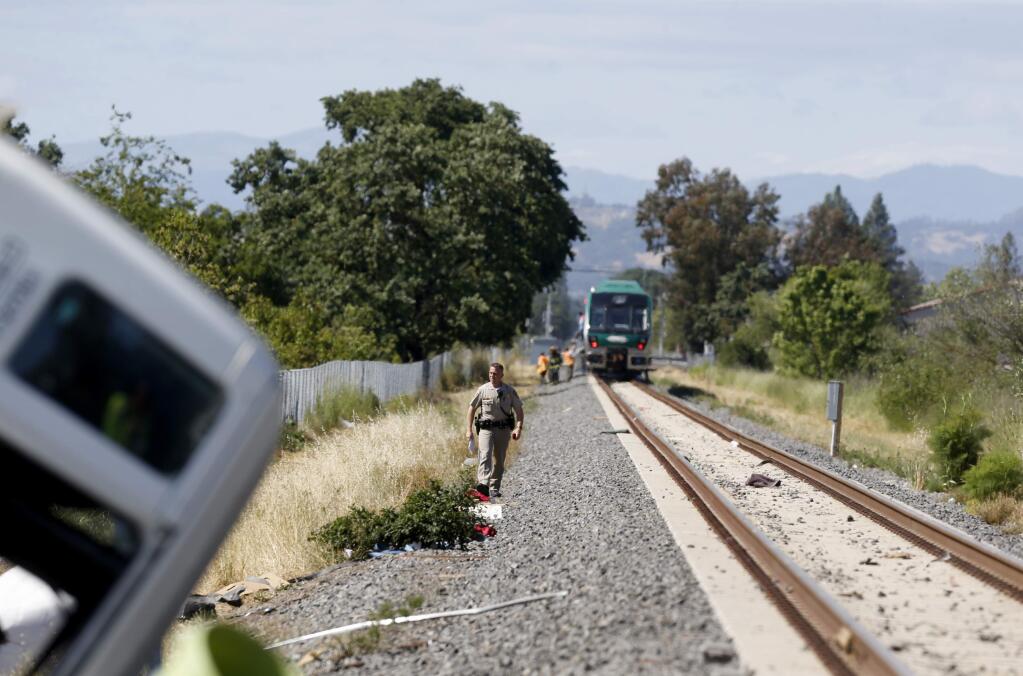 CHP officers respond to the scene of a SMART train and truck collision at the Todd Road crossing near Santa Rosa on Thursday, May 31, 2018. (BETH SCHLANKER/ PD)