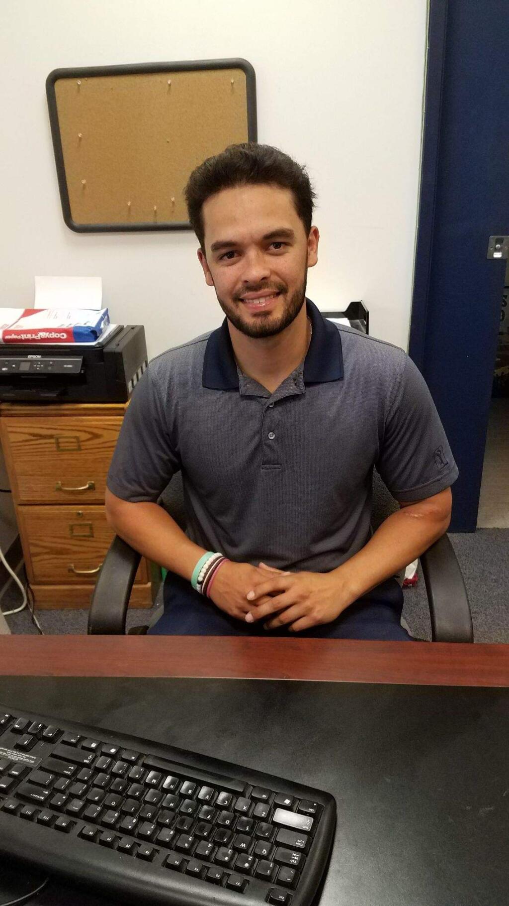 JOHN JACKSON/ARGUS-COURIER STAFFThings are beginning to settle down for new St. Vincent High School athletic director Dominic Romero.