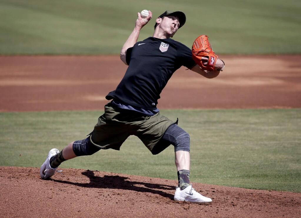 Pitcher Tim Lincecum throws for MLB baseball scouts, Friday, May 6, 2016, at Scottsdale Stadium in Scottsdale, Ariz. The former two-time Cy Young award winner, is currently a free agent working his way back from hip surgery. (AP Photo/Matt York)
