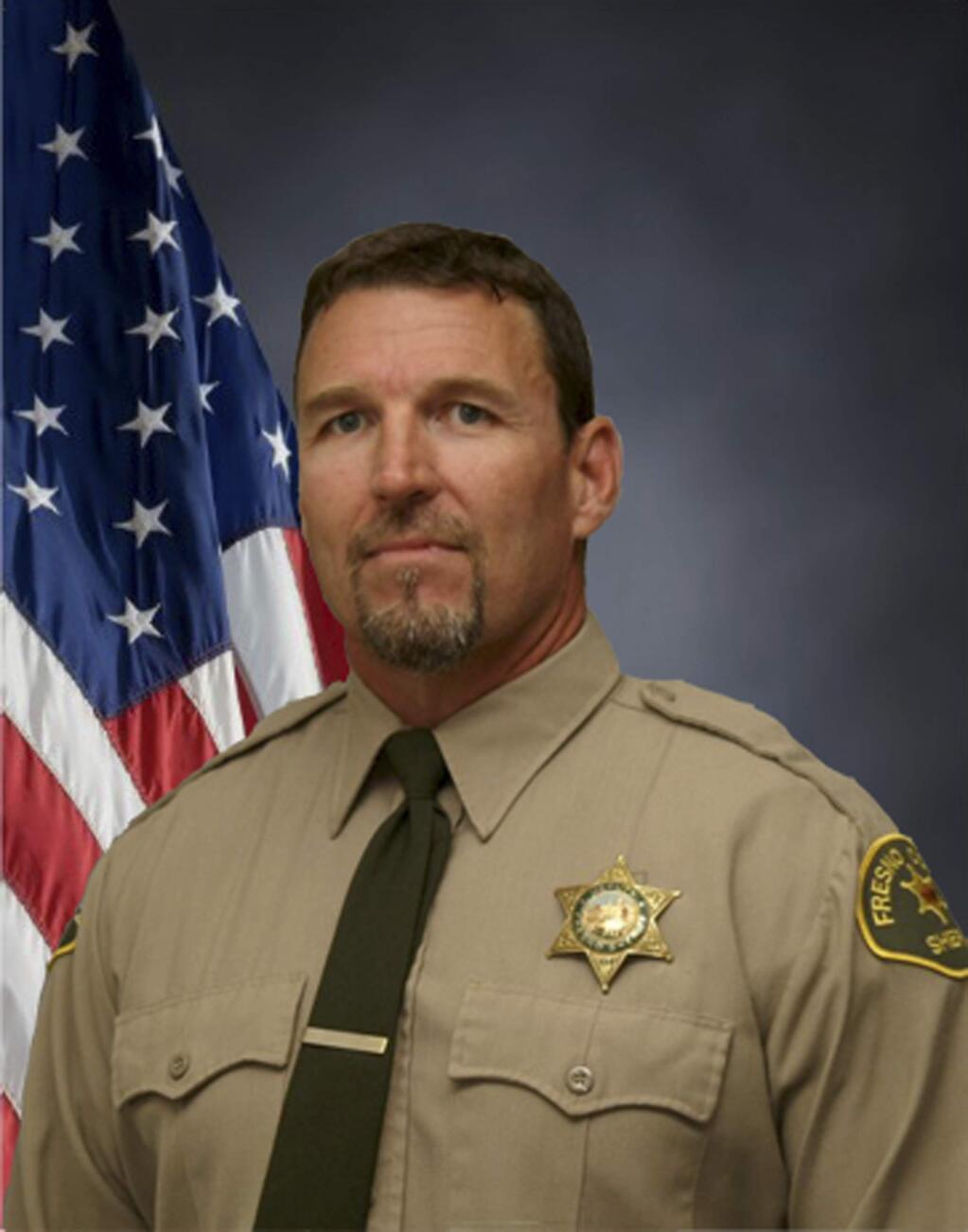In this undated photo released Tuesday, Nov. 1, 2016 by the Fresno County Sheriff's Office, is Deputy Sergeant Rod Lucas. the 20-year veteran was killed by a bullet in the chest from a colleague's gun in what officials said appeared to be 'a tragic accidental shooting.' Fresno Sheriff Margaret Mims said that Lucas was having a conversation with a detective about how to carry their backup weapons when the shot was fired that killed him on Monday, Oct. 31, 2016. The incident occurred at a sheriff's office near the Fresno Yosemite International Airport in Fresno, Calif. (Fresno County Sheriff's Office via AP)