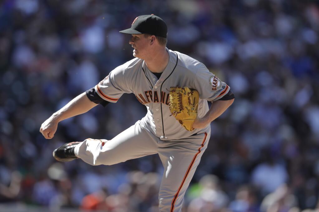 San Francisco Giants relief pitcher Matt Cain (18) in the fourth inning Monday, Sept. 5, 2016, in Denver. The Rockies won 6-0. (AP Photo/David Zalubowski)
