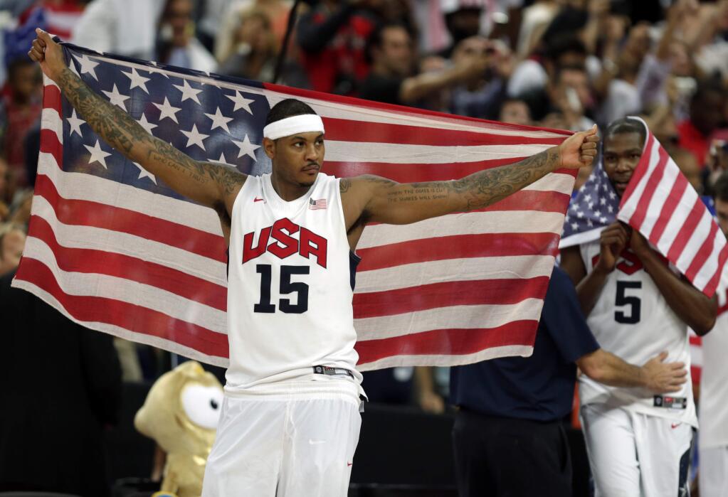 In this Aug. 12, 2012, file photo, United States' Carmelo Anthony celebrates after the men's gold medal basketball game at the 2012 Summer Olympics. At right is teammate Kevin Durant. A weakened U.S. basketball team believes it's still the strongest one in the Rio Olympics. (AP Photo/Charles Krupa, File)